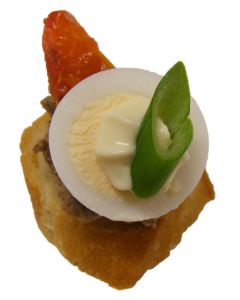 Quail Egg and Tomato on Baguettine with Tuna Tapenade